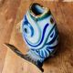 Blue ceramic zoomorphic vase in the shape of a poison.