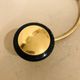 Gold and black metal coatrack 1960