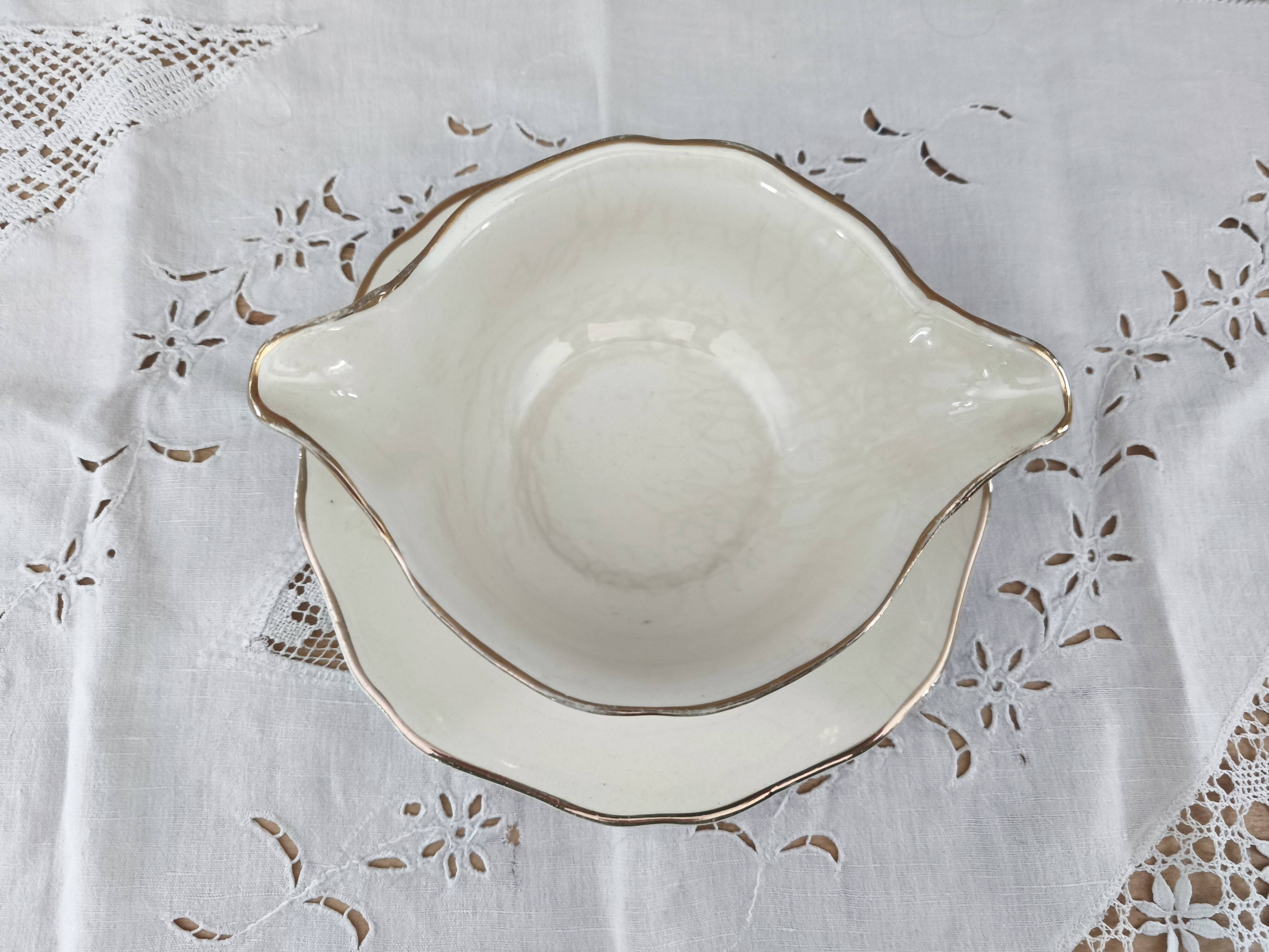 Round sauceboat on Longwy France earthenware frame, Trianon model