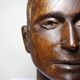 Monoxyle wood sculpture of a man's head, vintage craftsmanship from the 1950s.