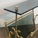 Brass magazine rack and blue-tinted glasses