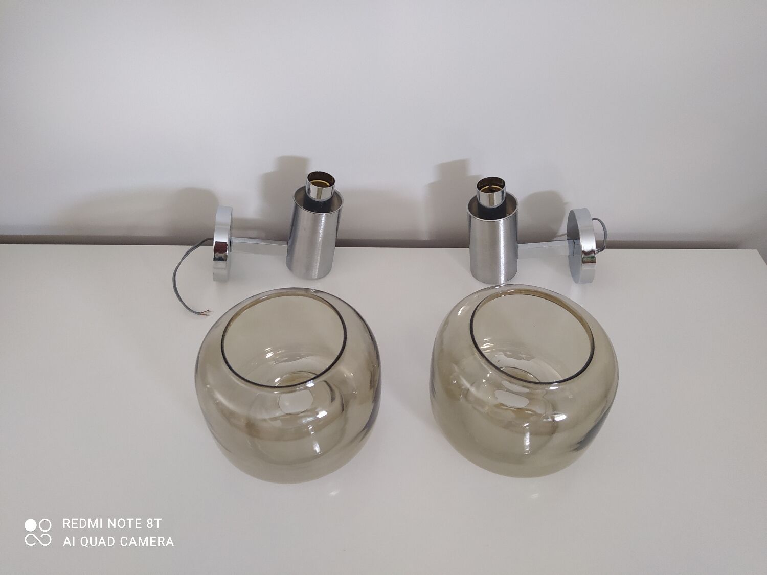 Pair of vintage chrome wall lights with smoked glass globe