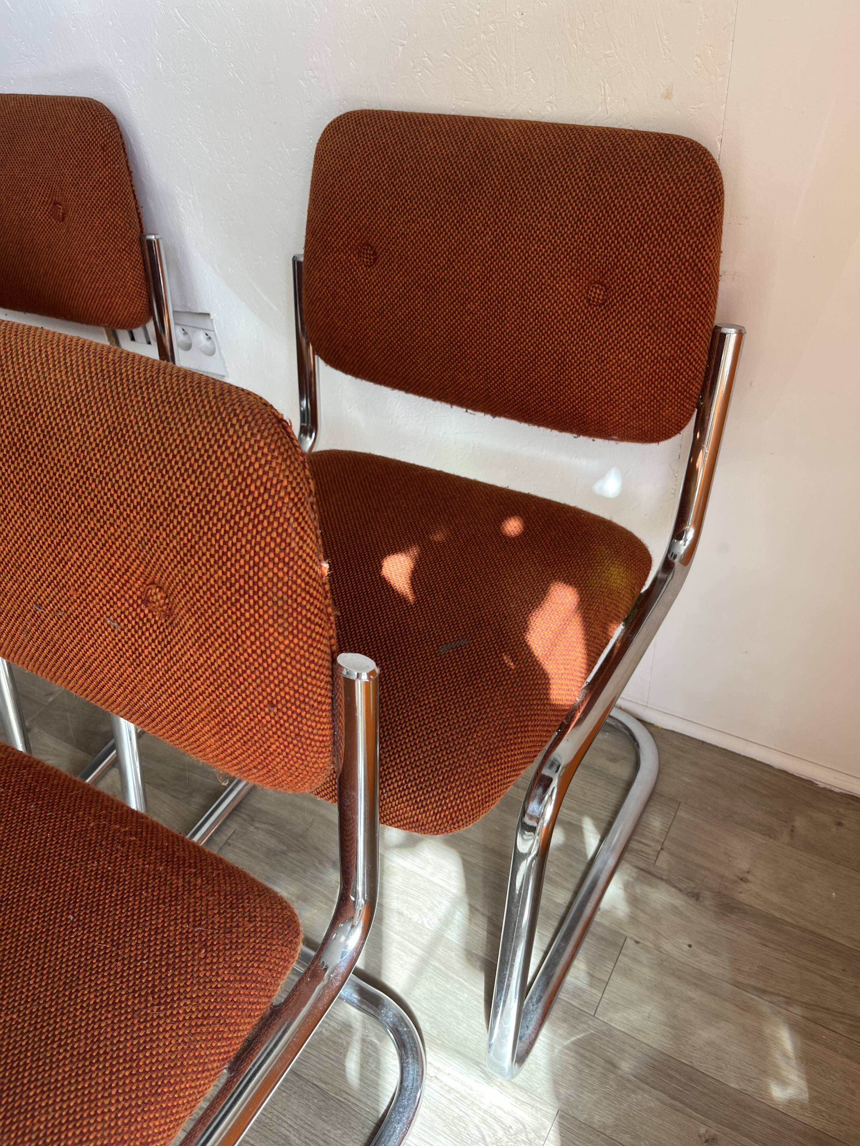 Vintage 70s orange tubular chairs