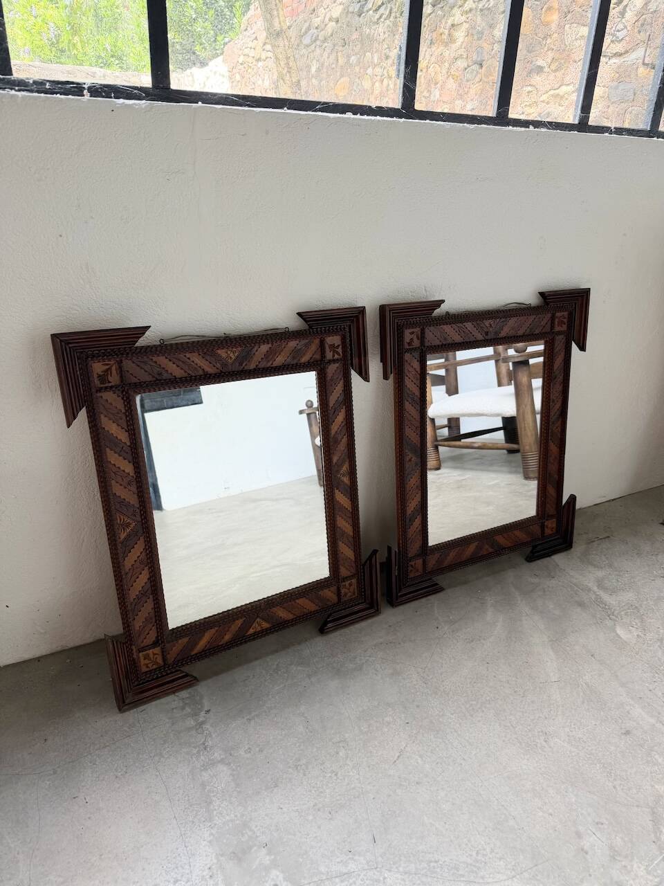 Pair of wooden mirrors in tramp art style