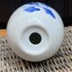 Decorative egg in white porcelain decoration blue flowers