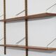 Danish wall shelving system in teak from the 1960s.