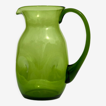 Green water jug in blown glass