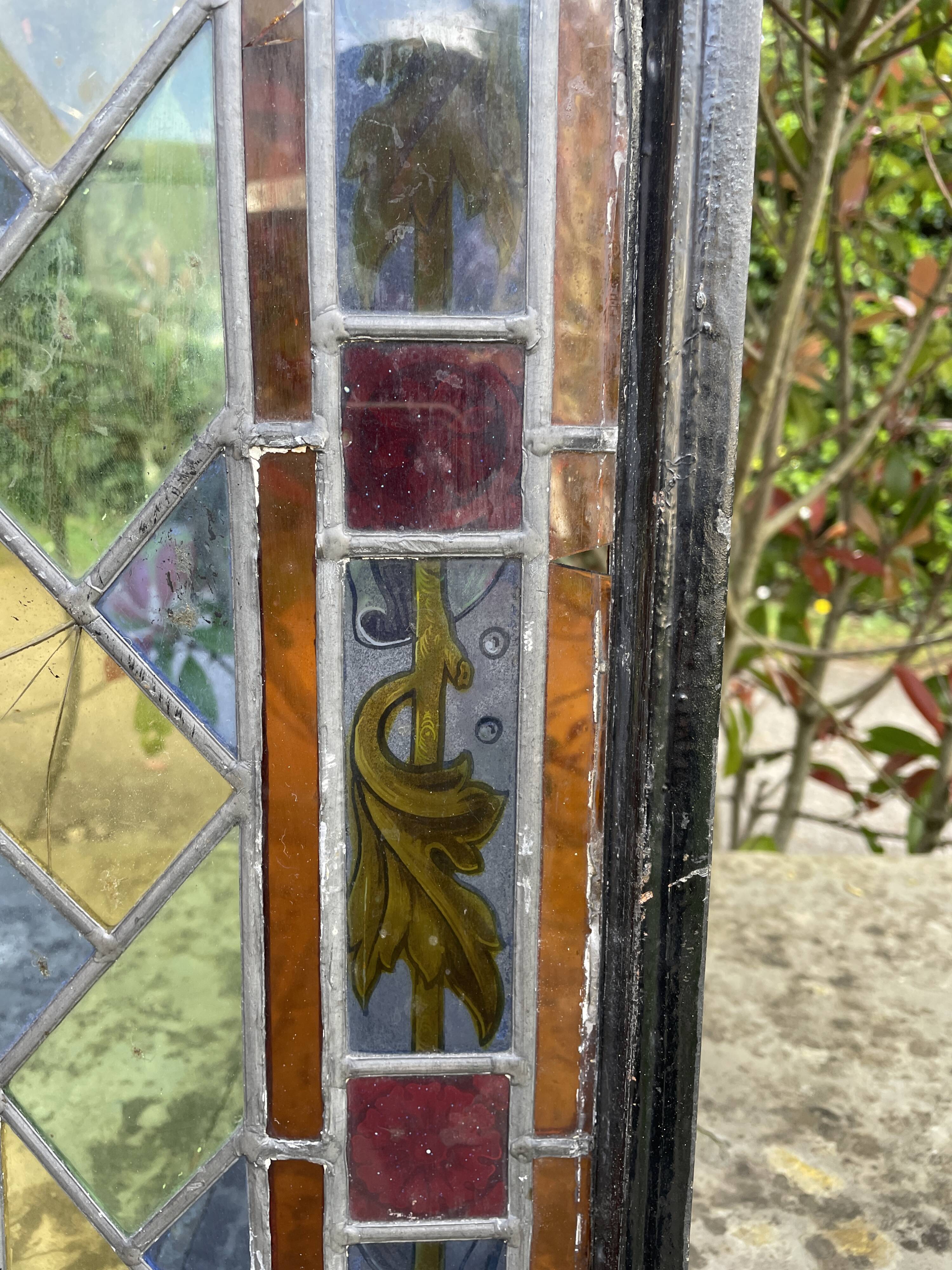 Pair of old double stained glass doors. Metal frames. Stained glass windows