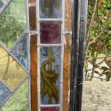 Pair of old double stained glass doors. Metal frames. Stained glass windows