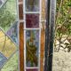 Pair of old double stained glass doors. Metal frames. Stained glass windows