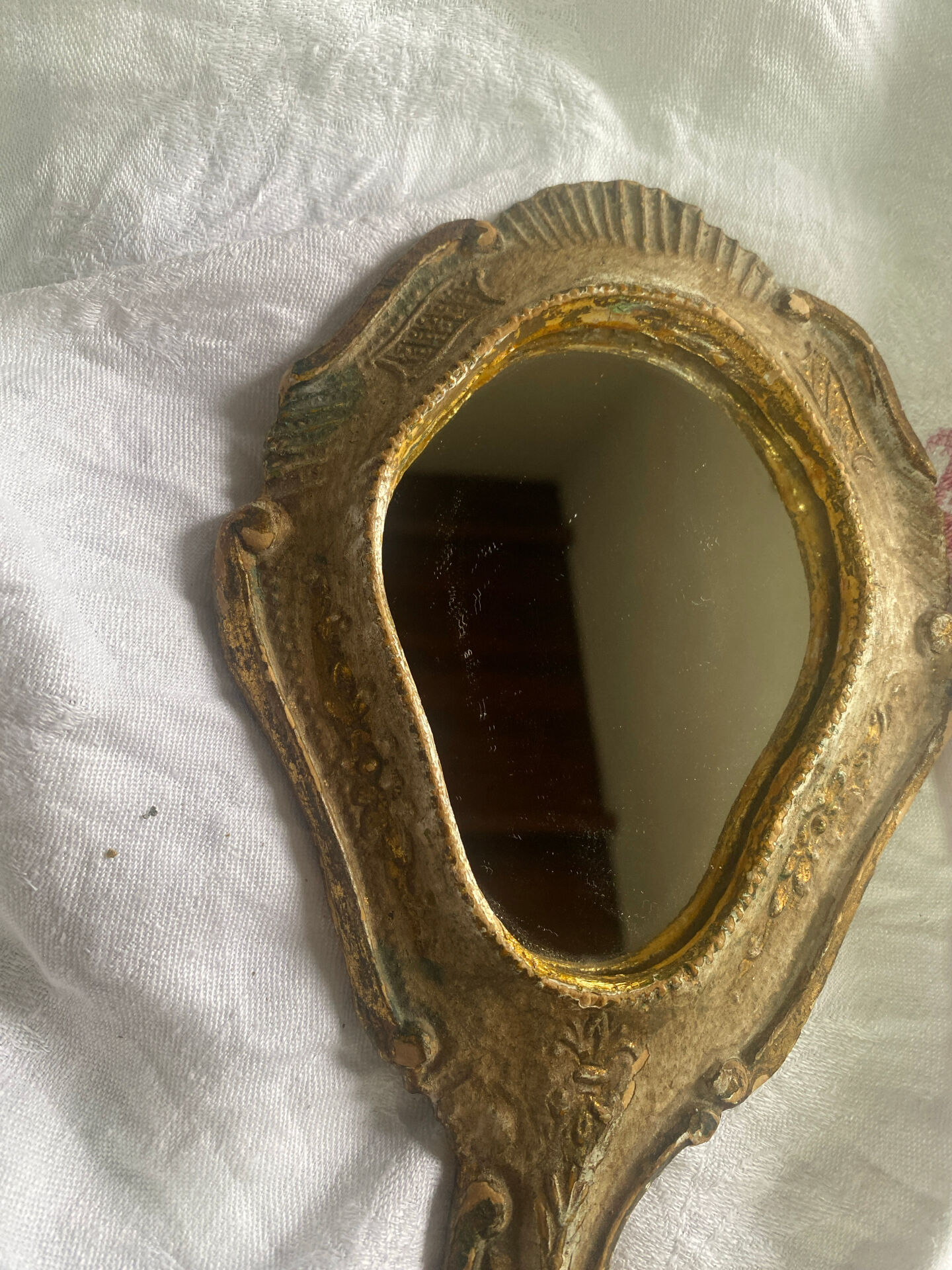 Patinated wooden Florentine hand mirror