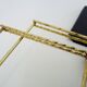 Vintage black and gold String design shelf. 60s