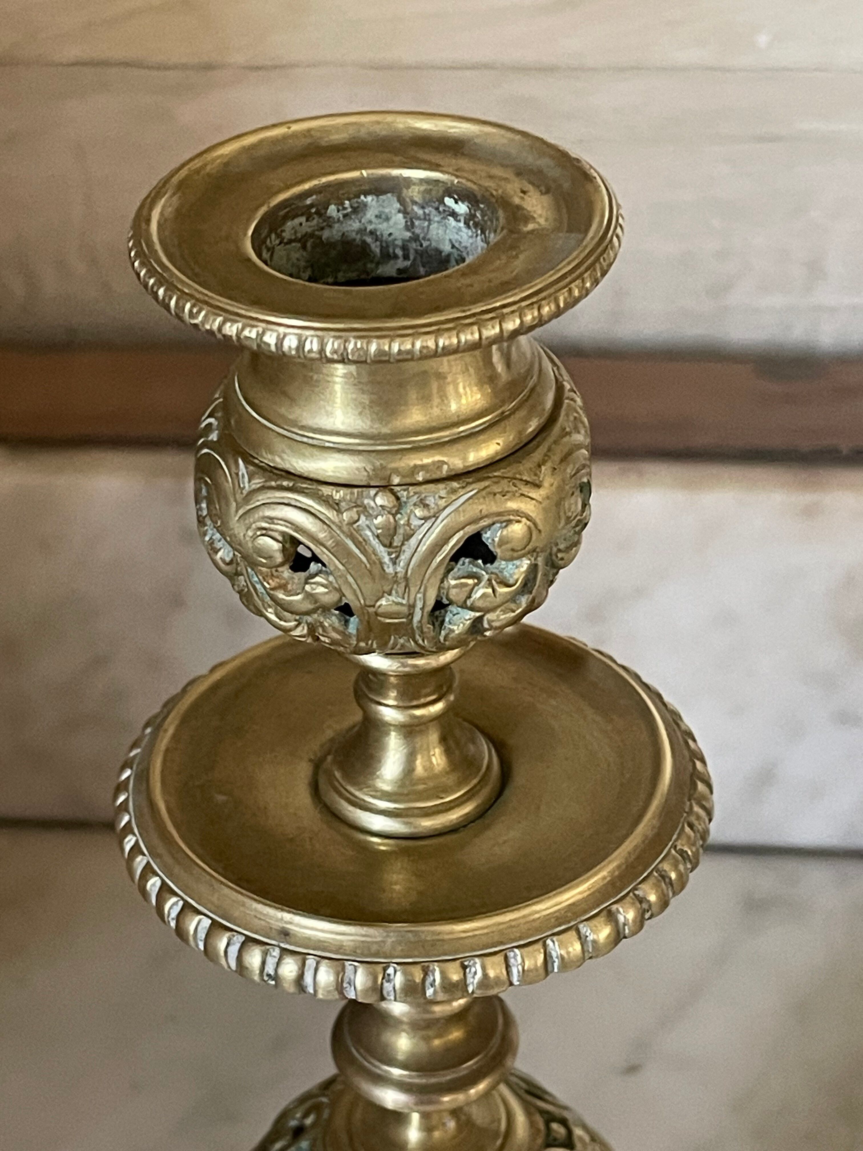 pair of openwork gilded brass candlesticks from the 19th century