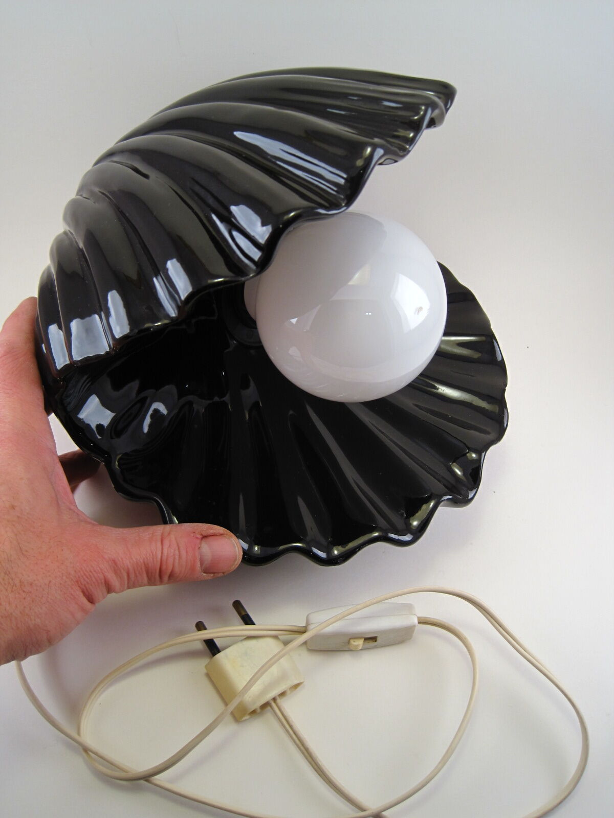 Vintage shell table lamp in black enamel ceramics design seventies 1970