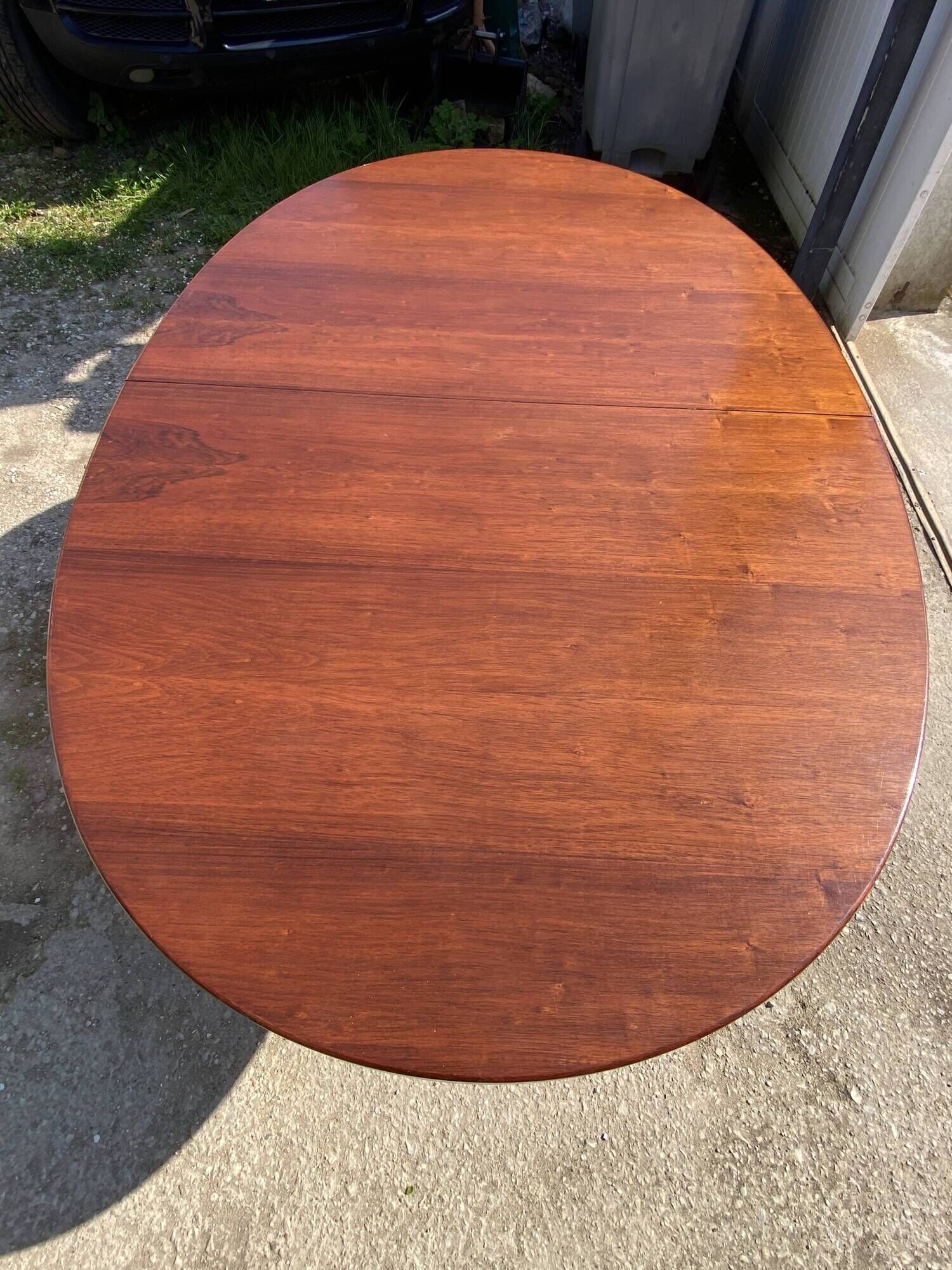 Baumann round oval extendable Scandinavian table in rosewood with 2 extensions.