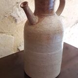 Vintage kid jug in two-tone sandstone with a handle and spout