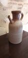 Vintage kid jug in two-tone sandstone with a handle and spout