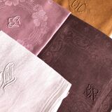 Set of four old damask towels tinted in multiple colors