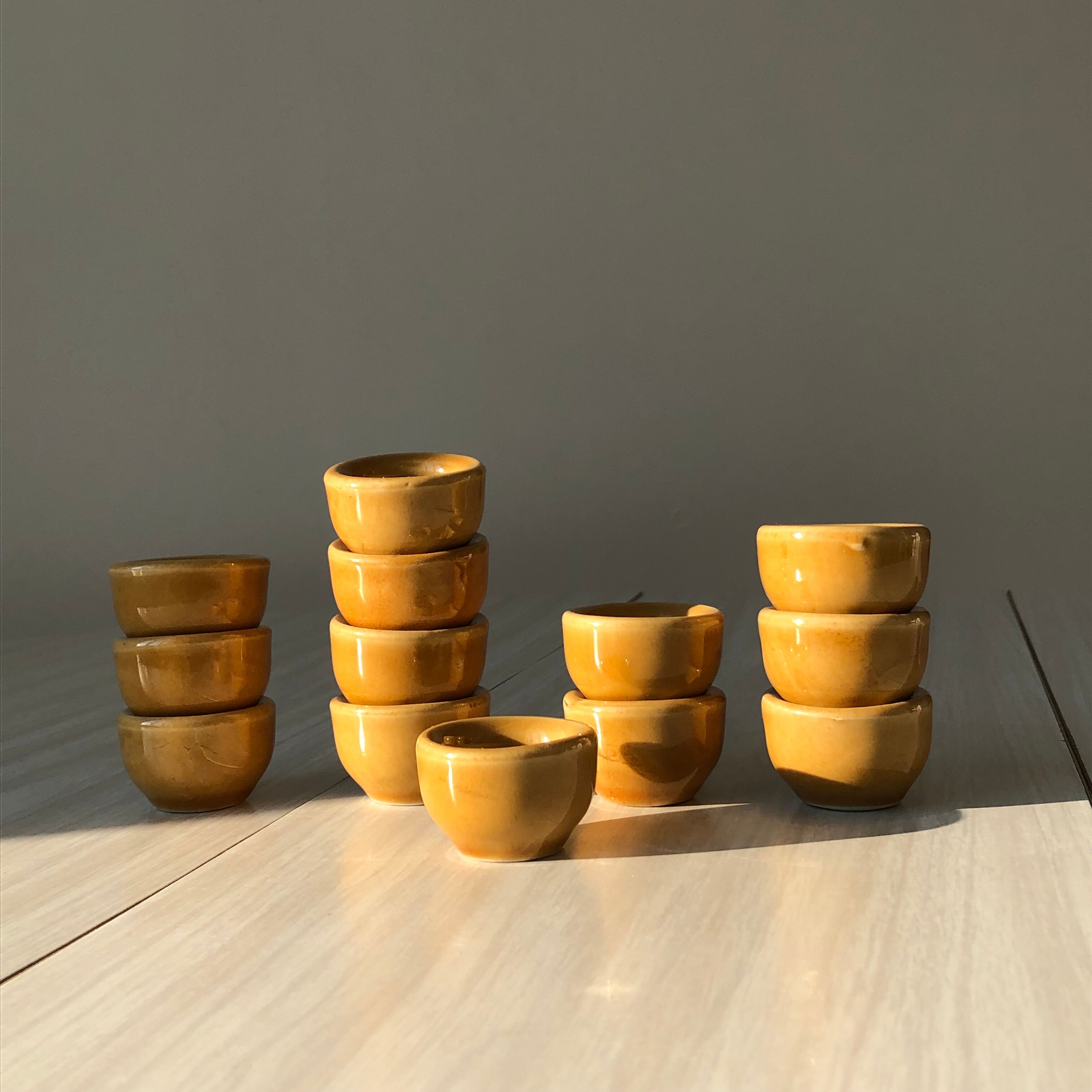 13 snail buckets or eggcups in fire porcelain glazed yellow-brown color