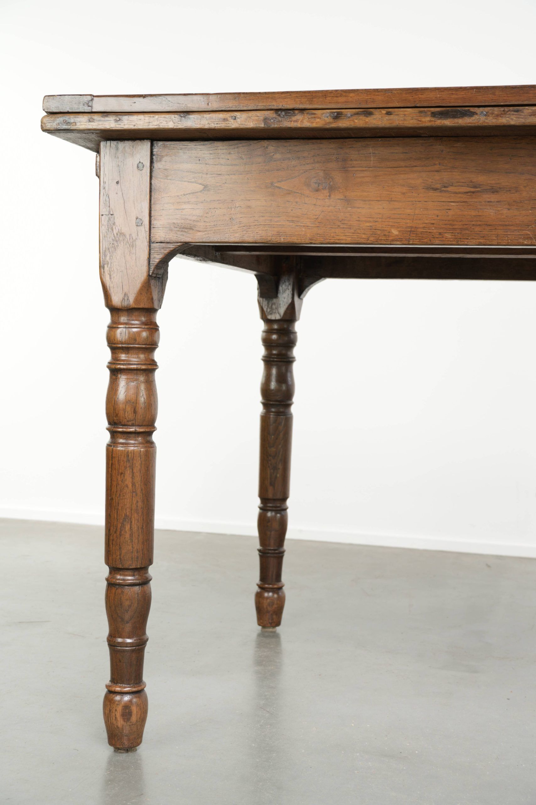 Antique oak dining table from the late 18th century with extendable leaves