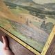 Old oil painting of a landscape on panel from 1920, haystacks.