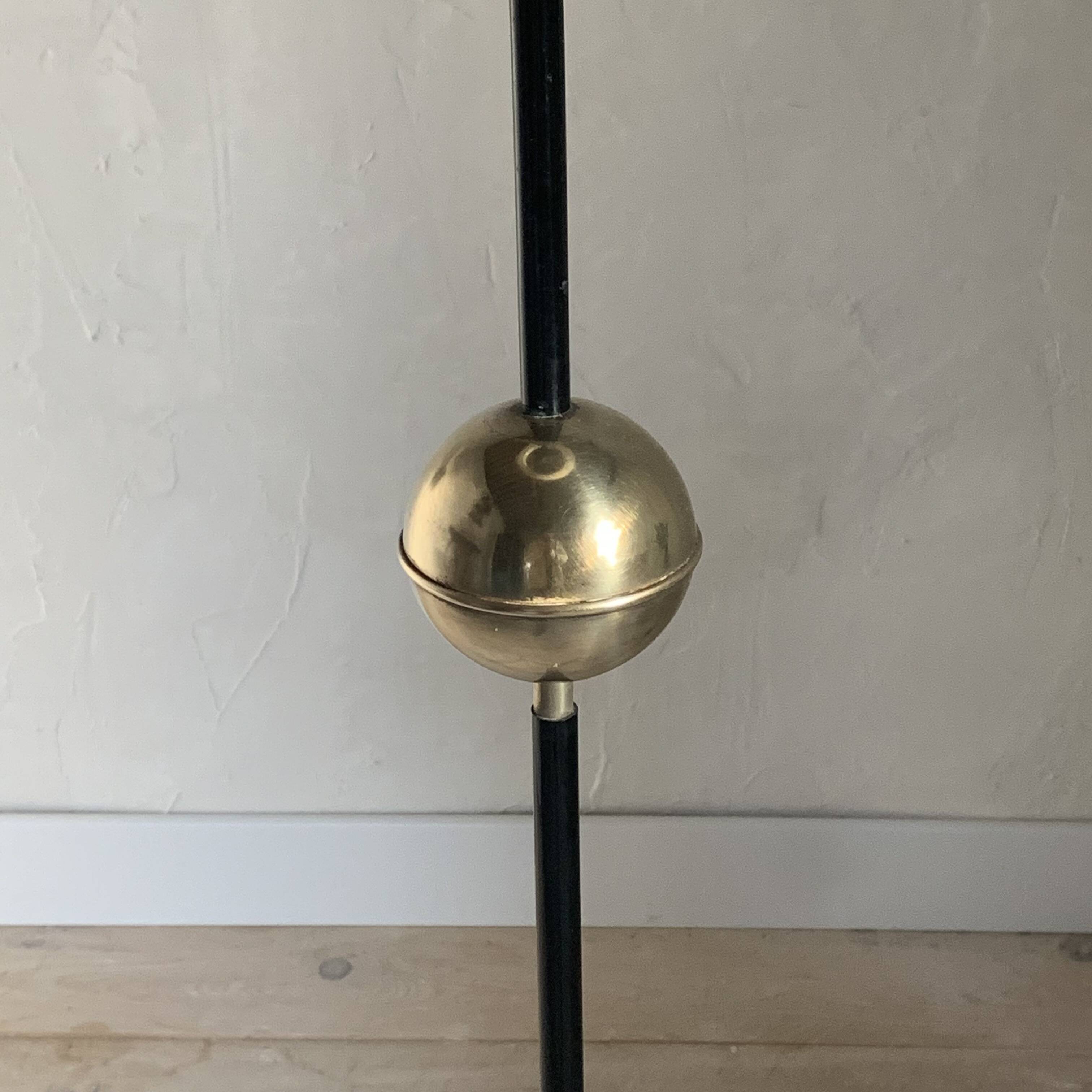 Vintage black metal tripod floor lamp and brass ball