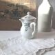 Vintage cream pot with Art Deco pattern and its lid.