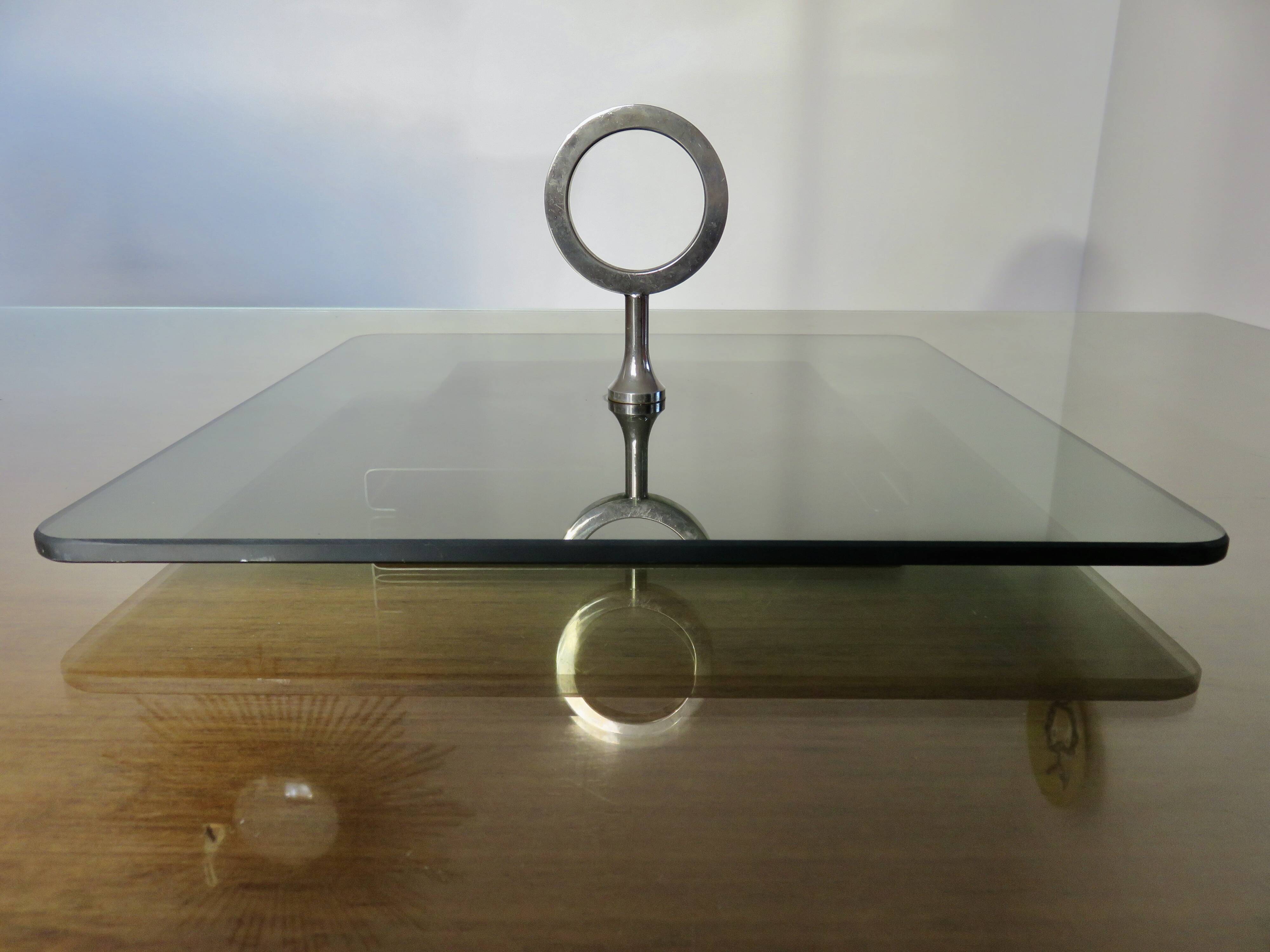 Modernist revolving serving tray, in smoked glass and silver-plated metal, 70.