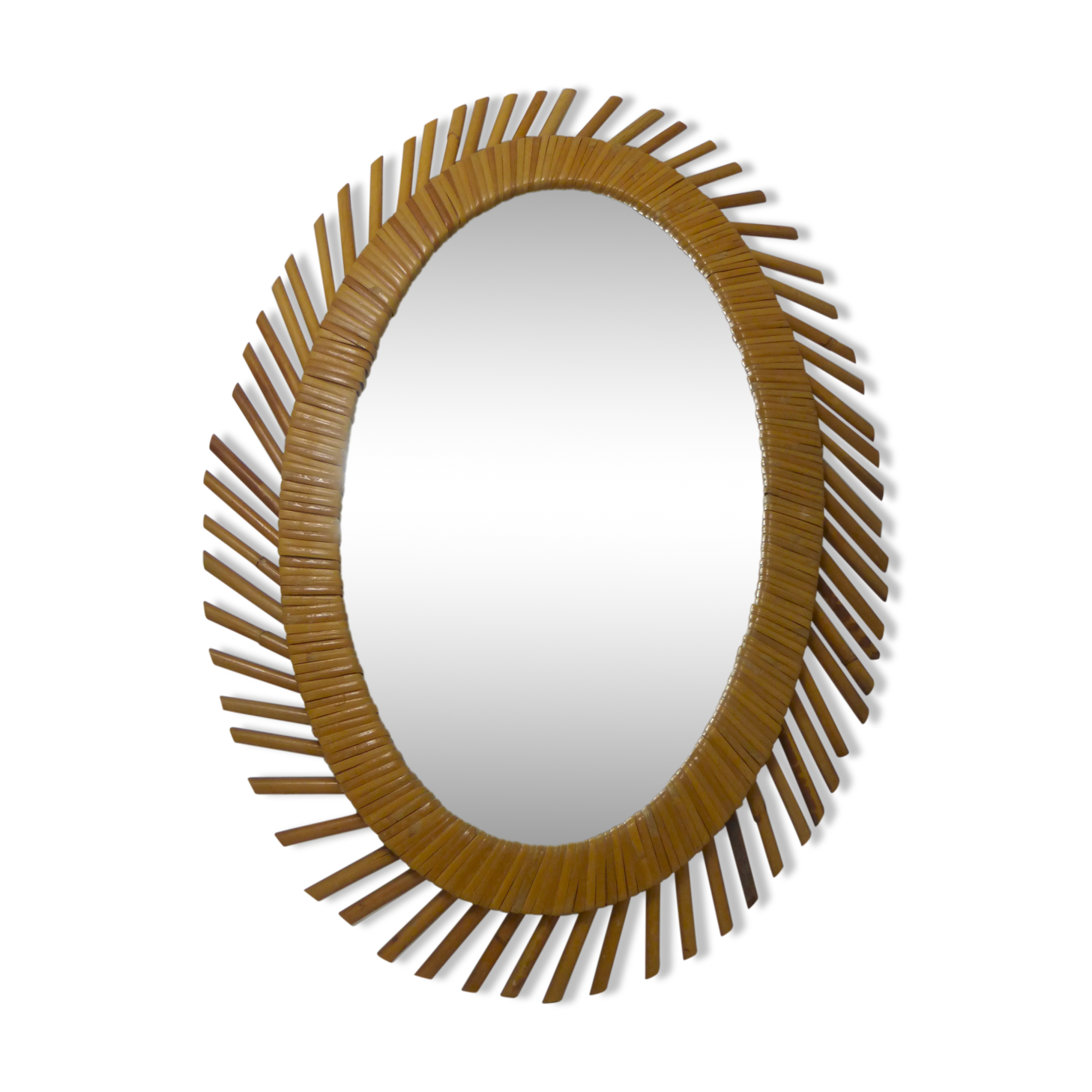 Mirror rattan oval radiating around 1960  - 37x50cm