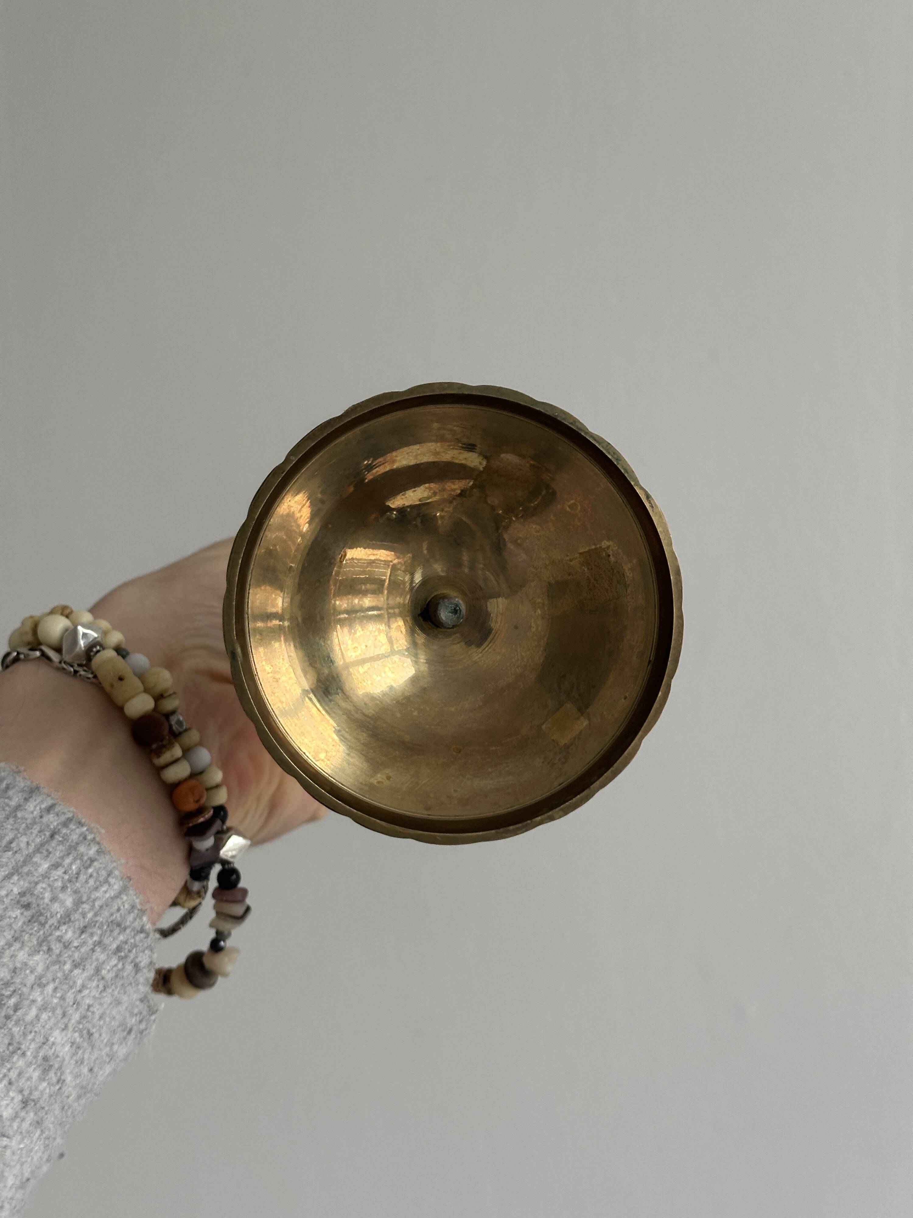 Pair of twisted metal and glass candlesticks