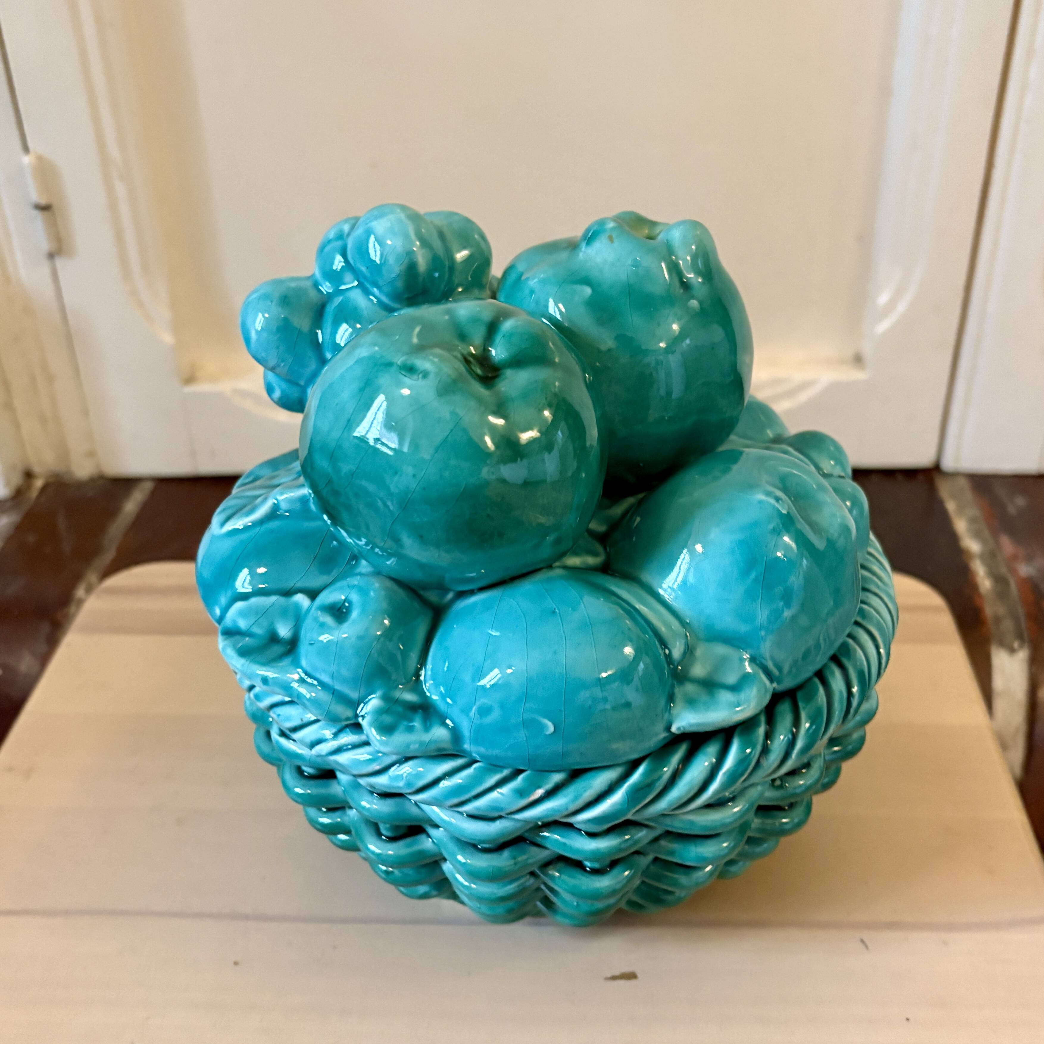 Vintage green earthenware plate/basket with fruit decorations.