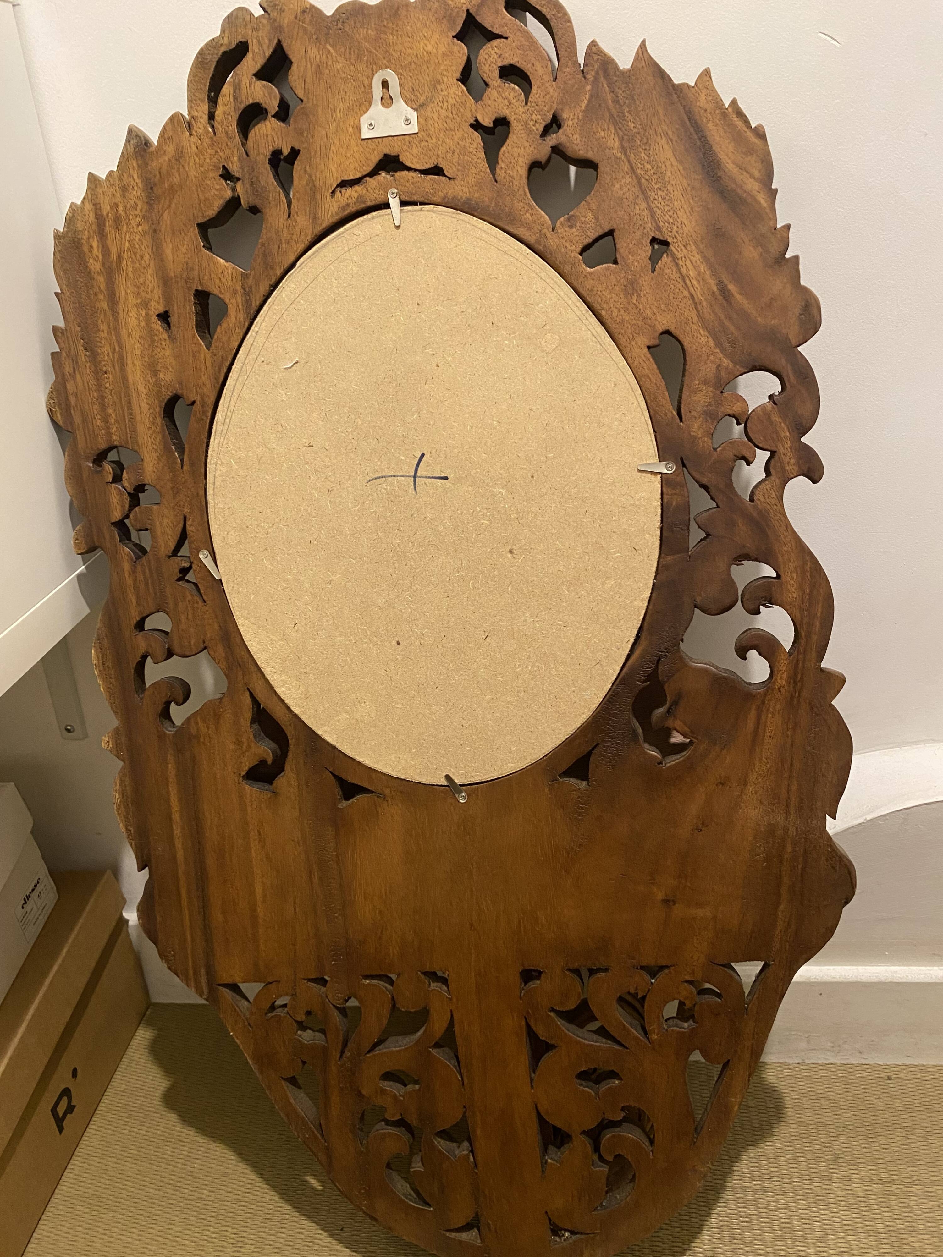 Carved mirror with integrated shelf