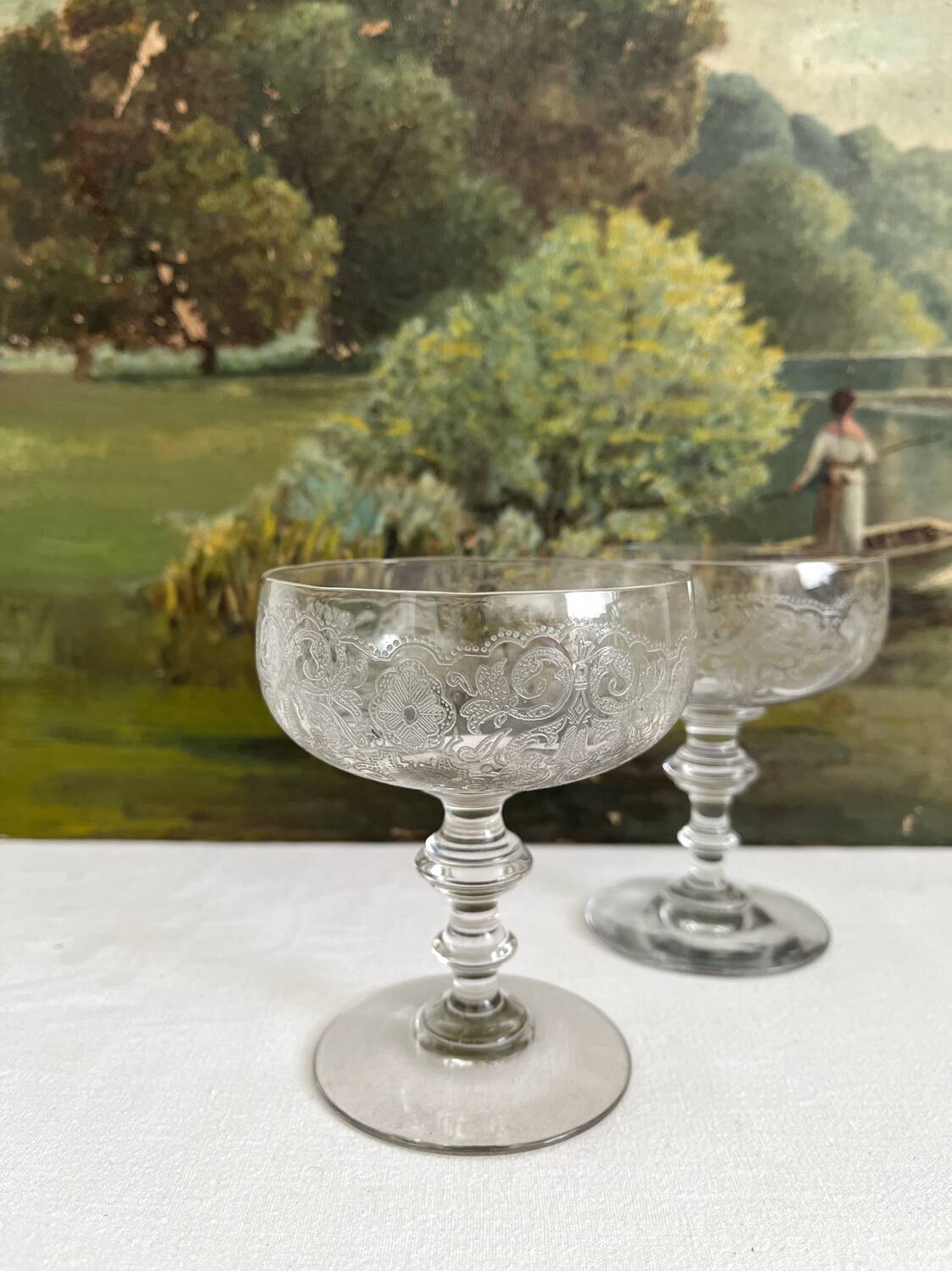 2 antique champagne glasses in engraved glass