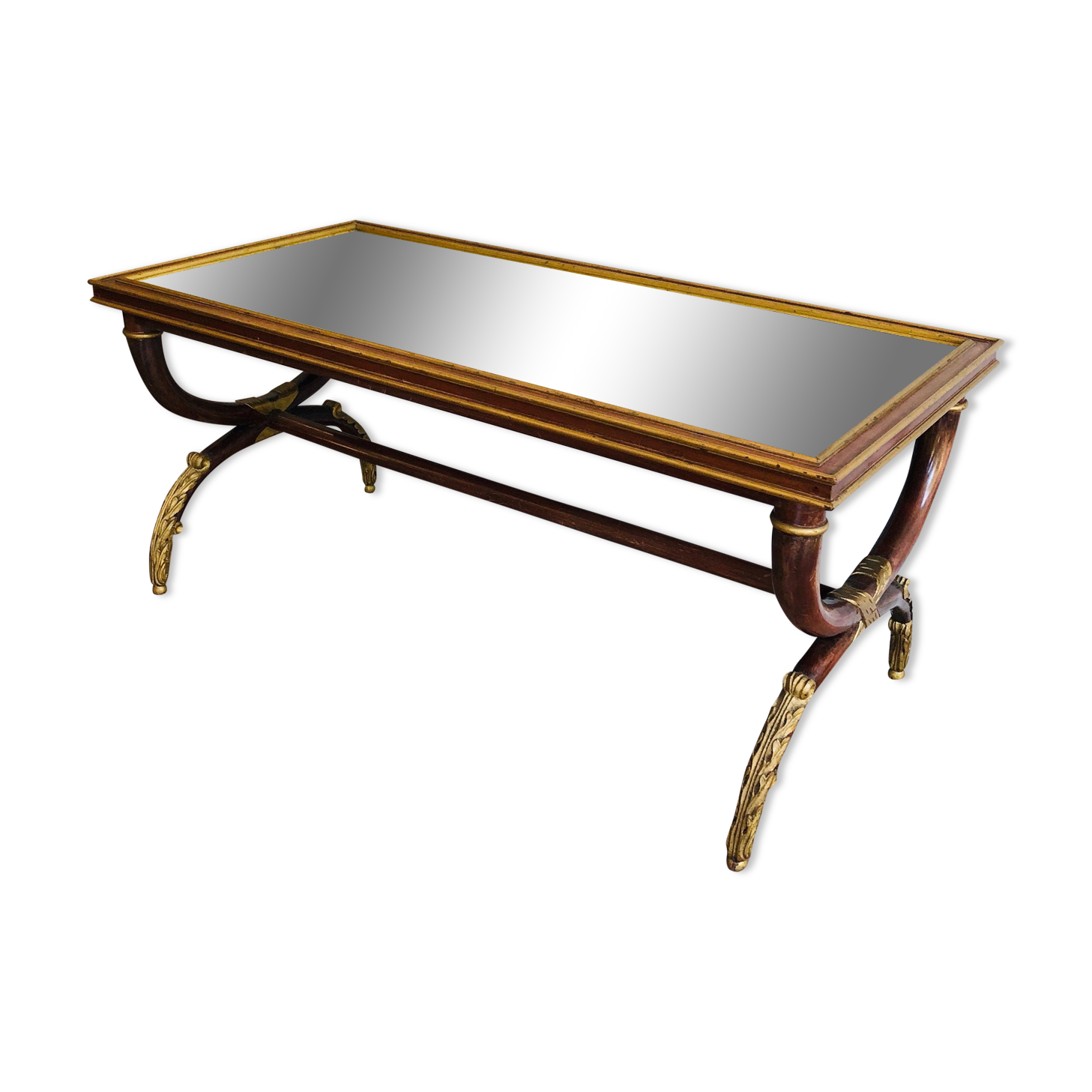 Coffee table in patinated and gilded carved wood with mirror top