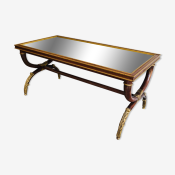 Coffee table in patinated and gilded carved wood with mirror top