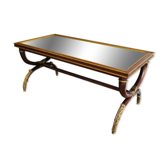 Coffee table in patinated and gilded carved wood with mirror top