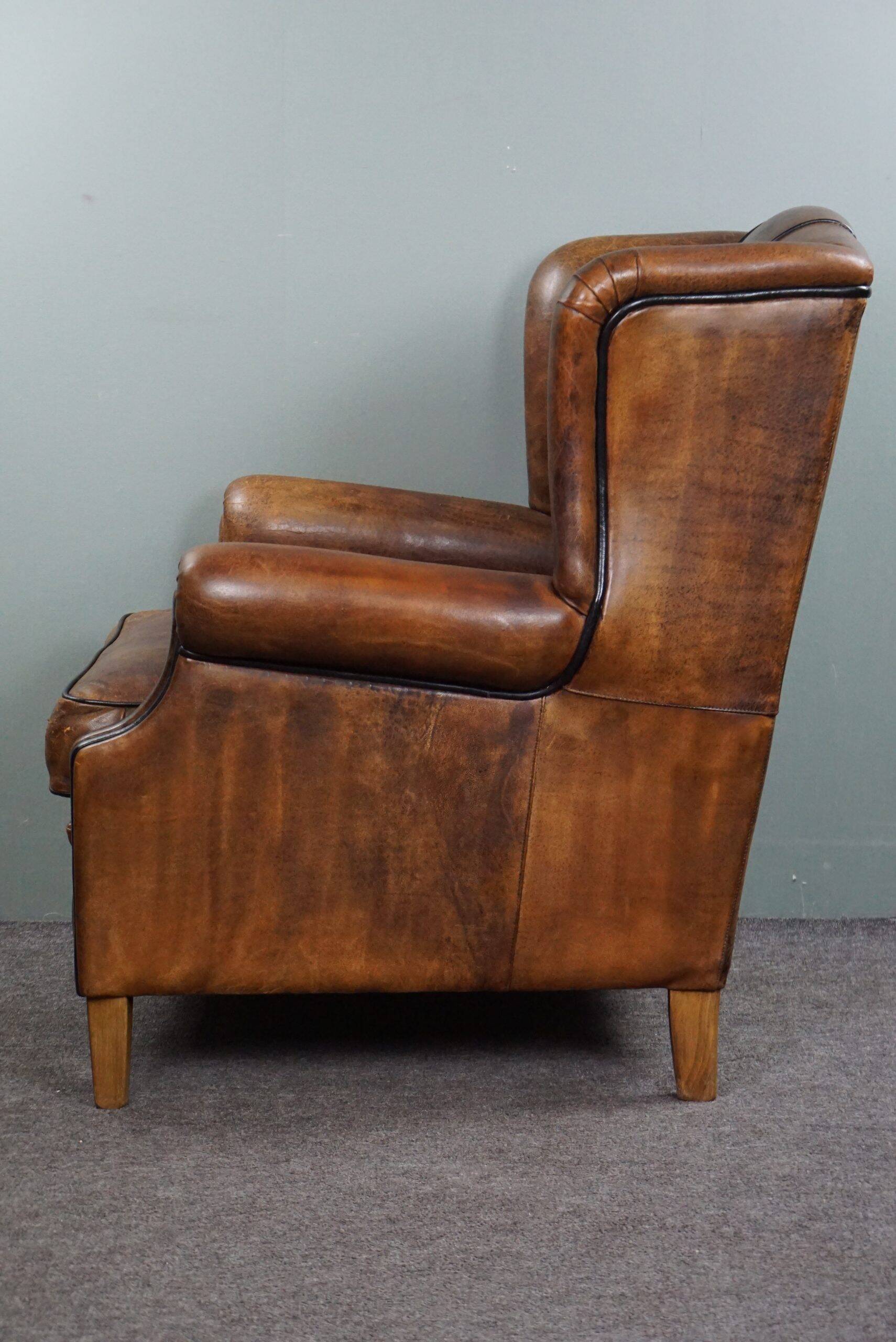 Fauteuil à oreilles en cuir de mouton