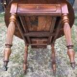 Louis Philippe oval shuttered table in solid cherry wood with 2 drawers.