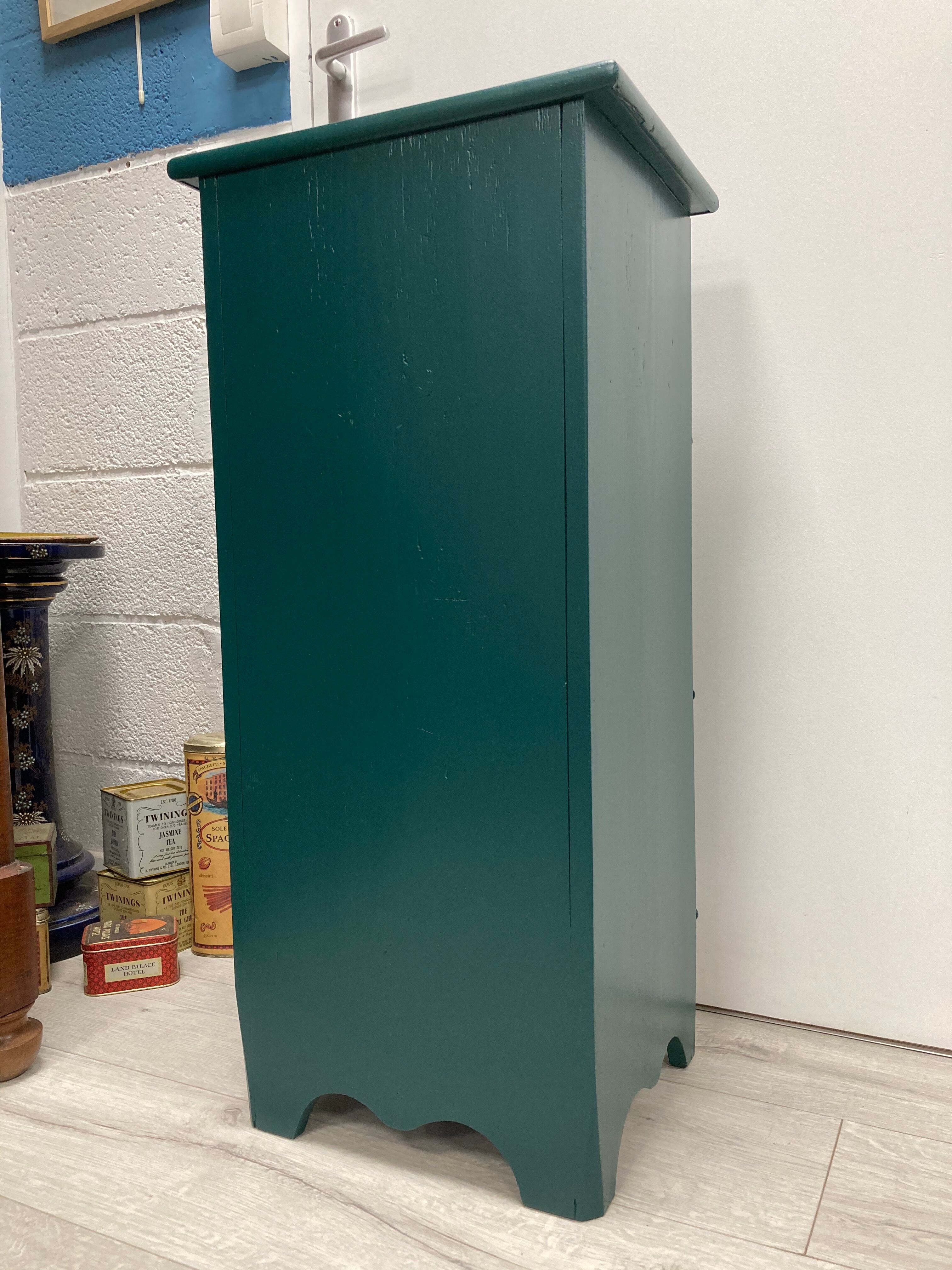 Two-door green bedside table