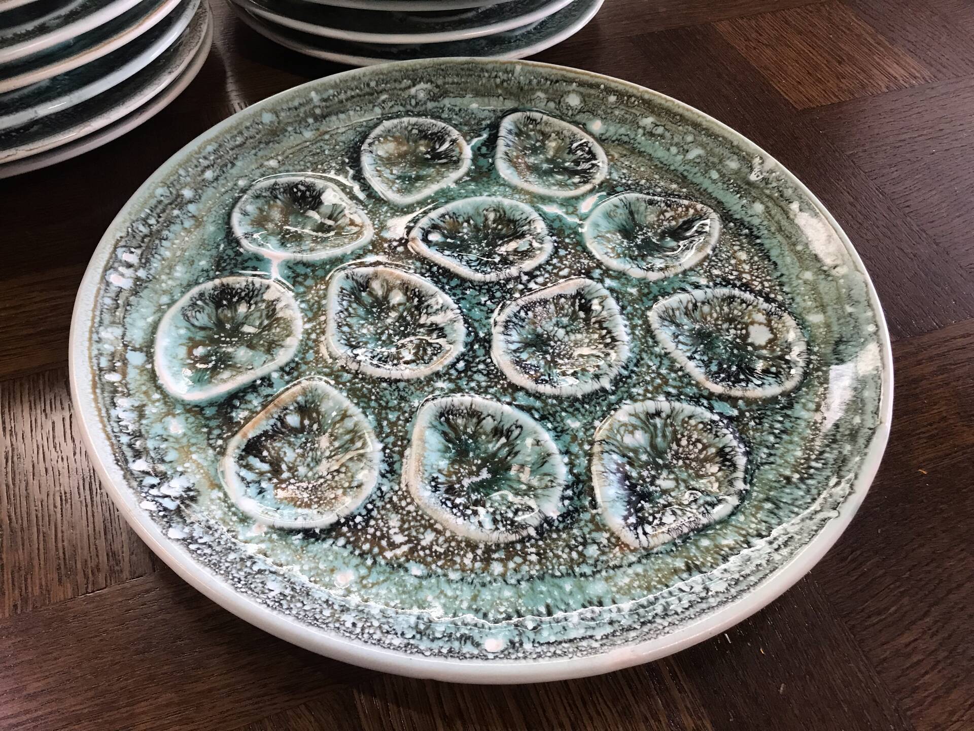 Set of 12 plates and an oyster dish or other in majolica.