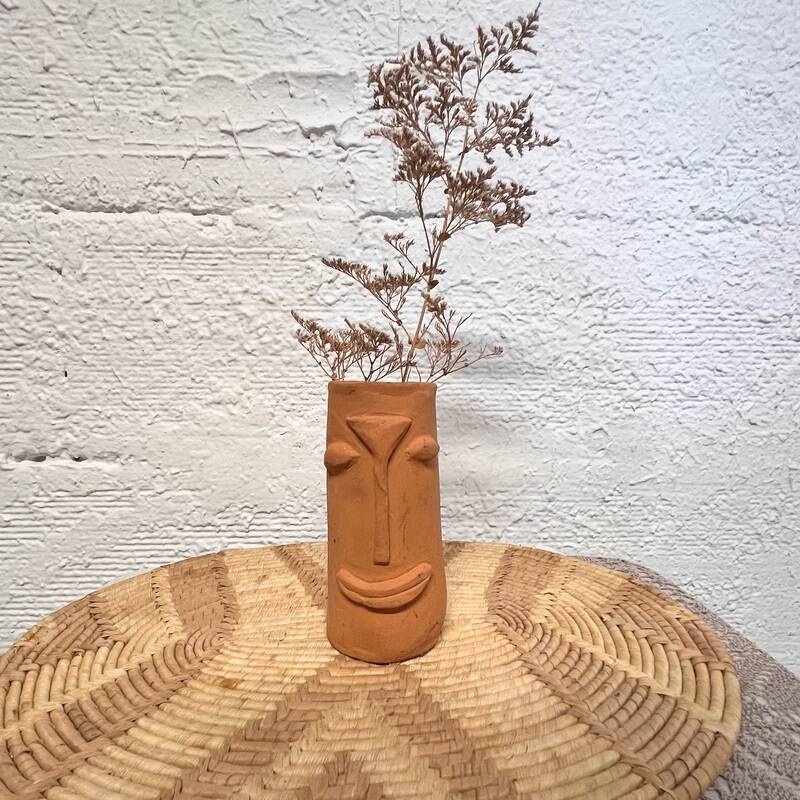 Face terracotta vase