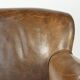 Robust cowhide armchair in a beautifully subtle size with a wonderful patina.