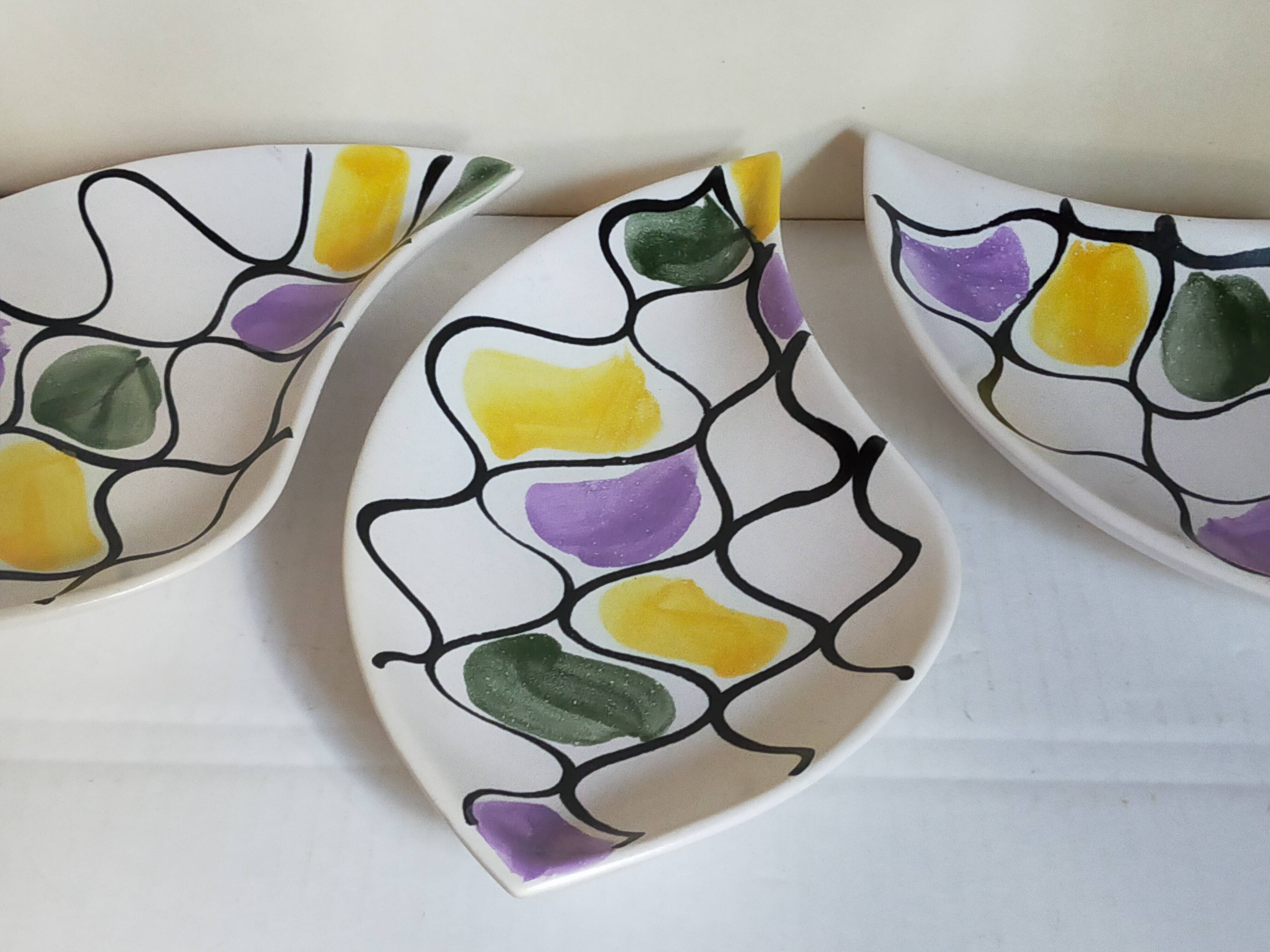 Three vintage free-form ceramic ravine dishes from the 1950s
