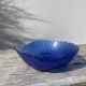 Blue glass shell emptier