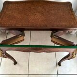 Console transforming into a 19th century Louis XV style gaming table