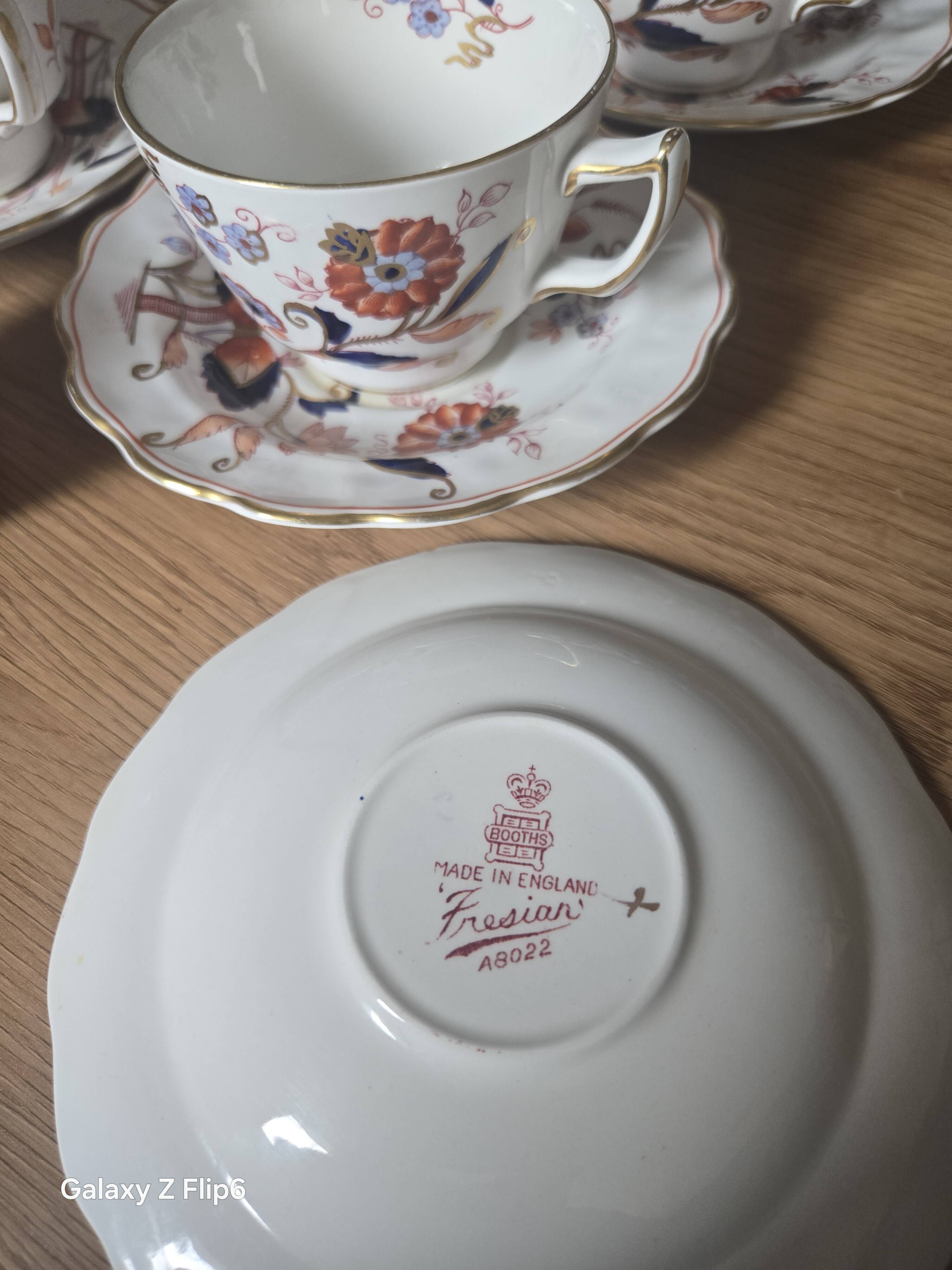 5 tea cups with saucers and 2 small pots, made in England.