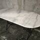 Oval bistro table in white marble with a black cast iron base - 120 cm