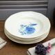 Six Art Deco Digoin earthenware soup bowls with blue rose motif