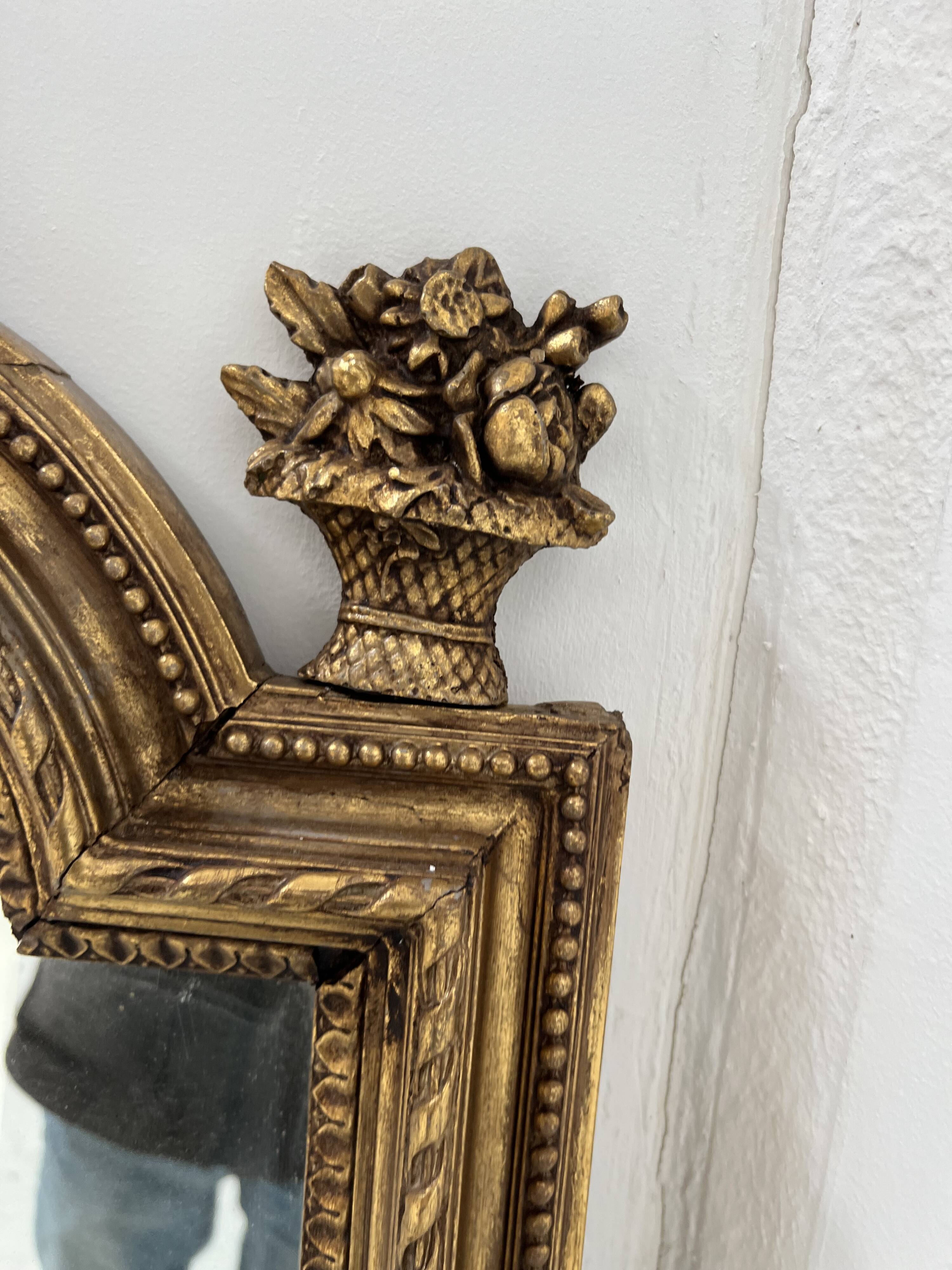 Louis XVI style mirror in wood and gilded stucco, 19th century