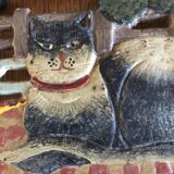 Dessous de plat en fonte avec un motif de chat sur son tapis